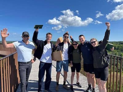 The Ramskov team celebrating with arms raised at their 2026 summit